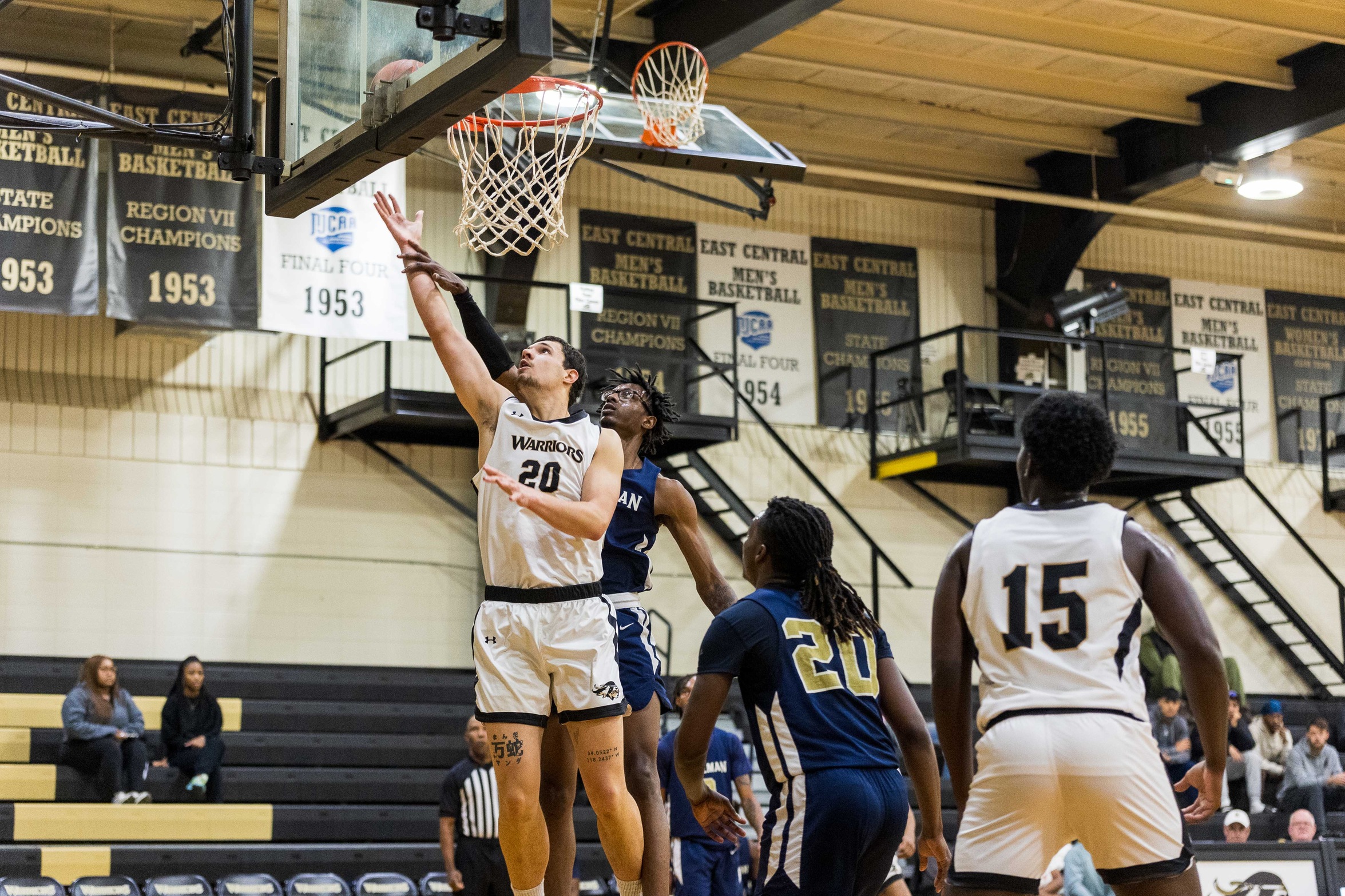 #20 Zivko Damjanovic makes a layup.