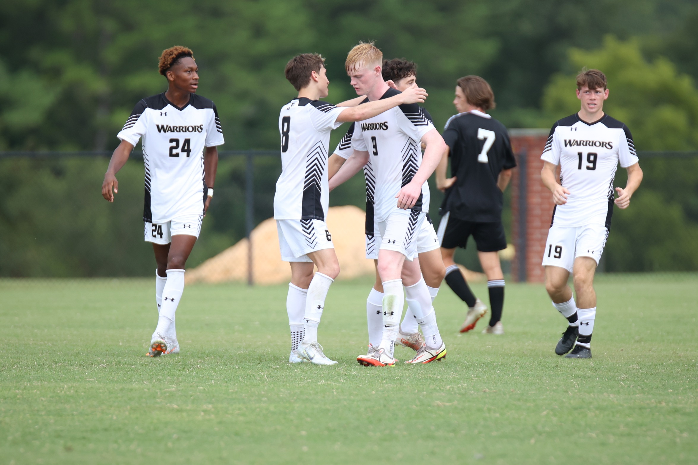 Warriors Down Holmes in Conference Opener